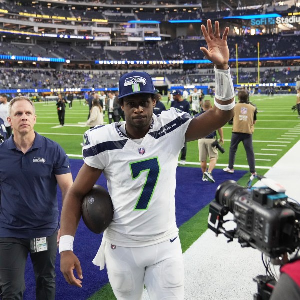 Seattle Seahawks quarterback Geno Smith (7) walks off the field after a win over the Los Angeles Rams in an NFL football game Sunday, Jan. 5, 2025, in Inglewood, Calif. (AP Photo/Eric Thayer)