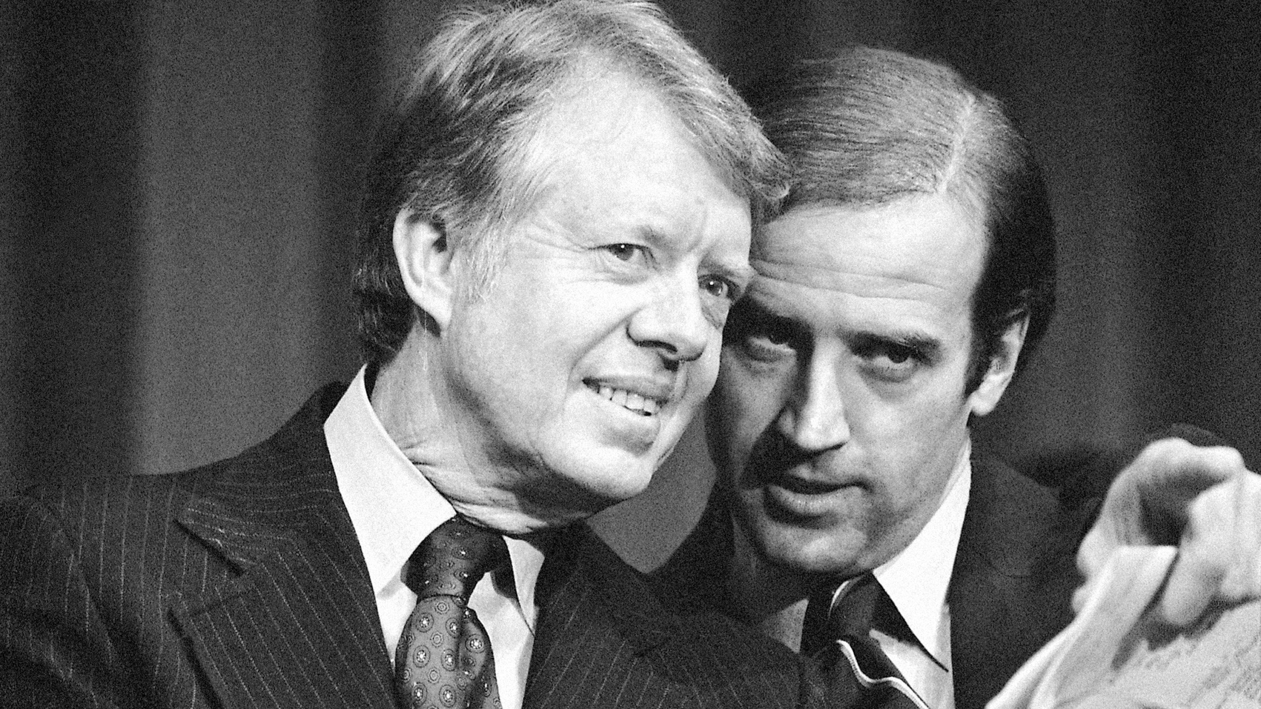 FILE - President Jimmy Carter listens to Sen. Joseph R. Biden, D-Del., as they wait to speak at fund raising reception at Padua Academy in Wilmington, Del., Feb. 20, 1978. (AP Photo/Barry Thumma, File)