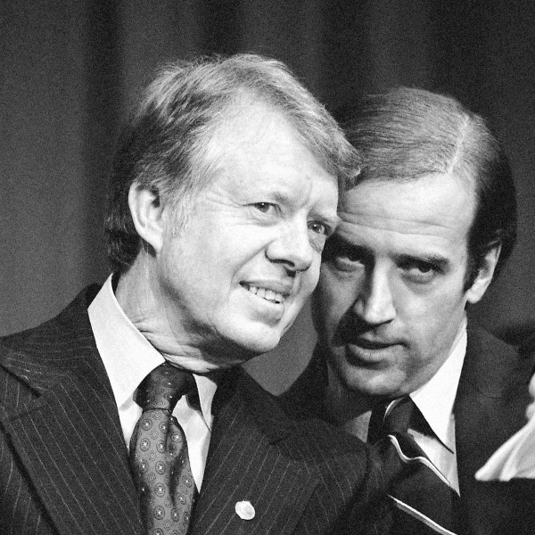 FILE - President Jimmy Carter listens to Sen. Joseph R. Biden, D-Del., as they wait to speak at fund raising reception at Padua Academy in Wilmington, Del., Feb. 20, 1978. (AP Photo/Barry Thumma, File)