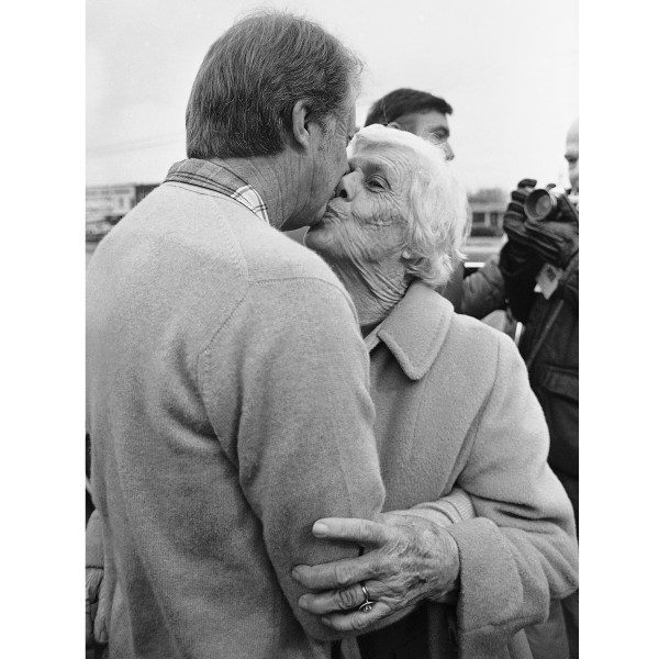 FILE - President-elect Jimmy Carter gets a kiss from his mother, Lillian Carter, on Dec. 6, 1976, in Plains, Ga. (AP Photo/File)