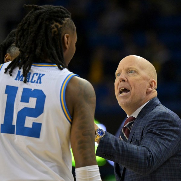 UCLA head coach Mick Cronin instructs UCLA guard Sebastian Mack (12) during the first half of an NCAA college basketball game against Michigan, Tuesday, Jan. 7, 2025, in Los Angeles. (AP Photo/Jayne Kamin-Oncea)