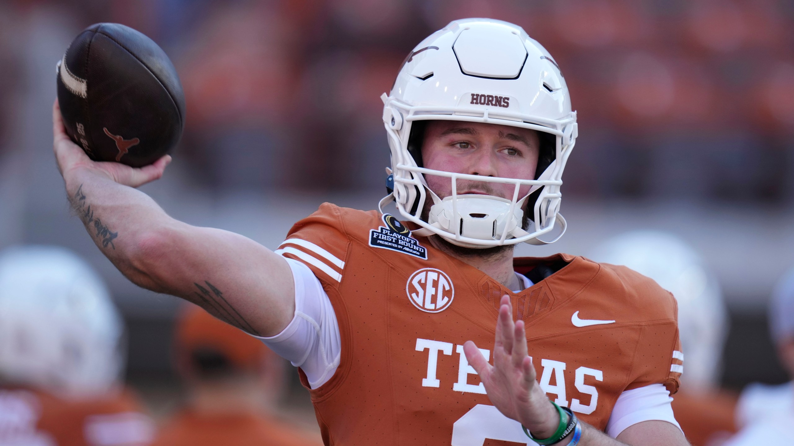 Texas quarterback Quinn Ewers warms up before a first round game against Clemson in the College Football Playoff, Saturday, Dec. 21, 2024, in Austin, Texas. (AP Photo/Eric Gay)