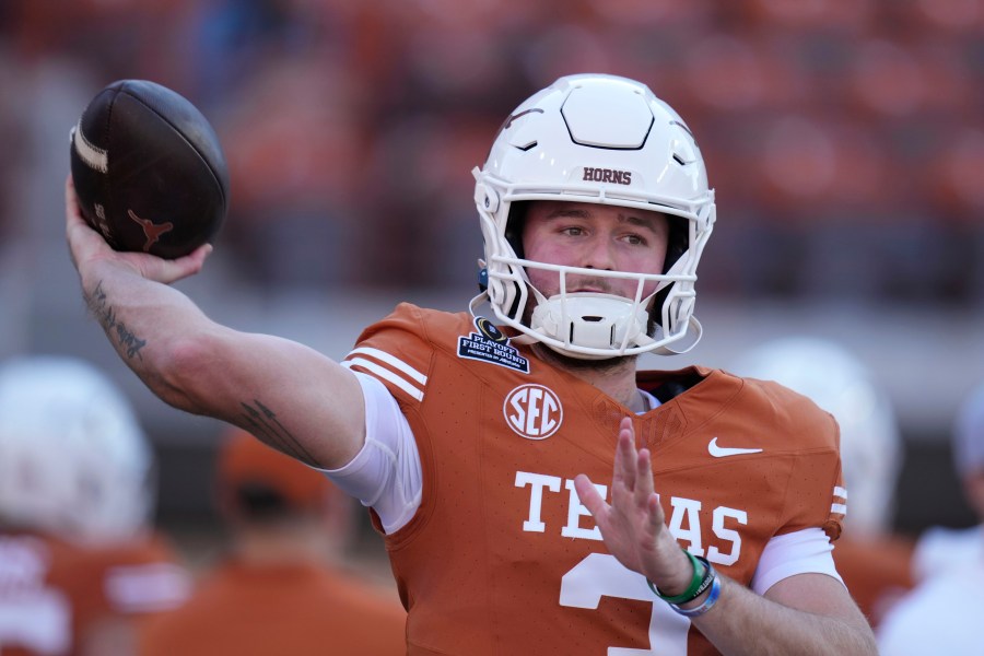 Texas quarterback Quinn Ewers warms up before a first round game against Clemson in the College Football Playoff, Saturday, Dec. 21, 2024, in Austin, Texas. (AP Photo/Eric Gay)