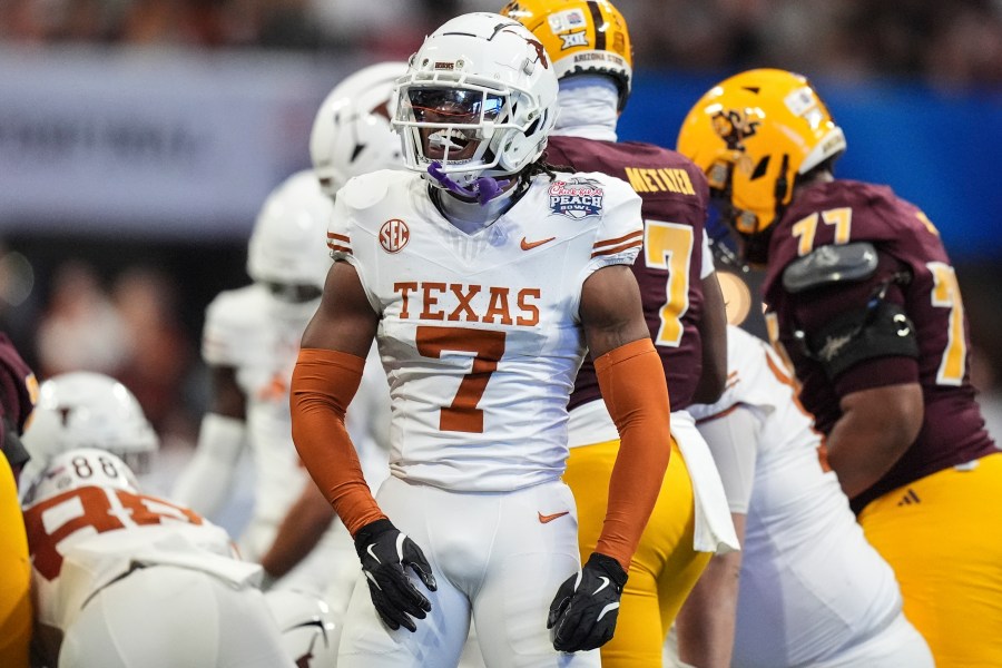 Texas defensive back Jahdae Barron (7) celebrates a defensive play against Arizona State during the first half in the quarterfinals of a College Football Playoff, Wednesday, Jan. 1, 2025, in Atlanta. (AP Photo/Brynn Anderson)