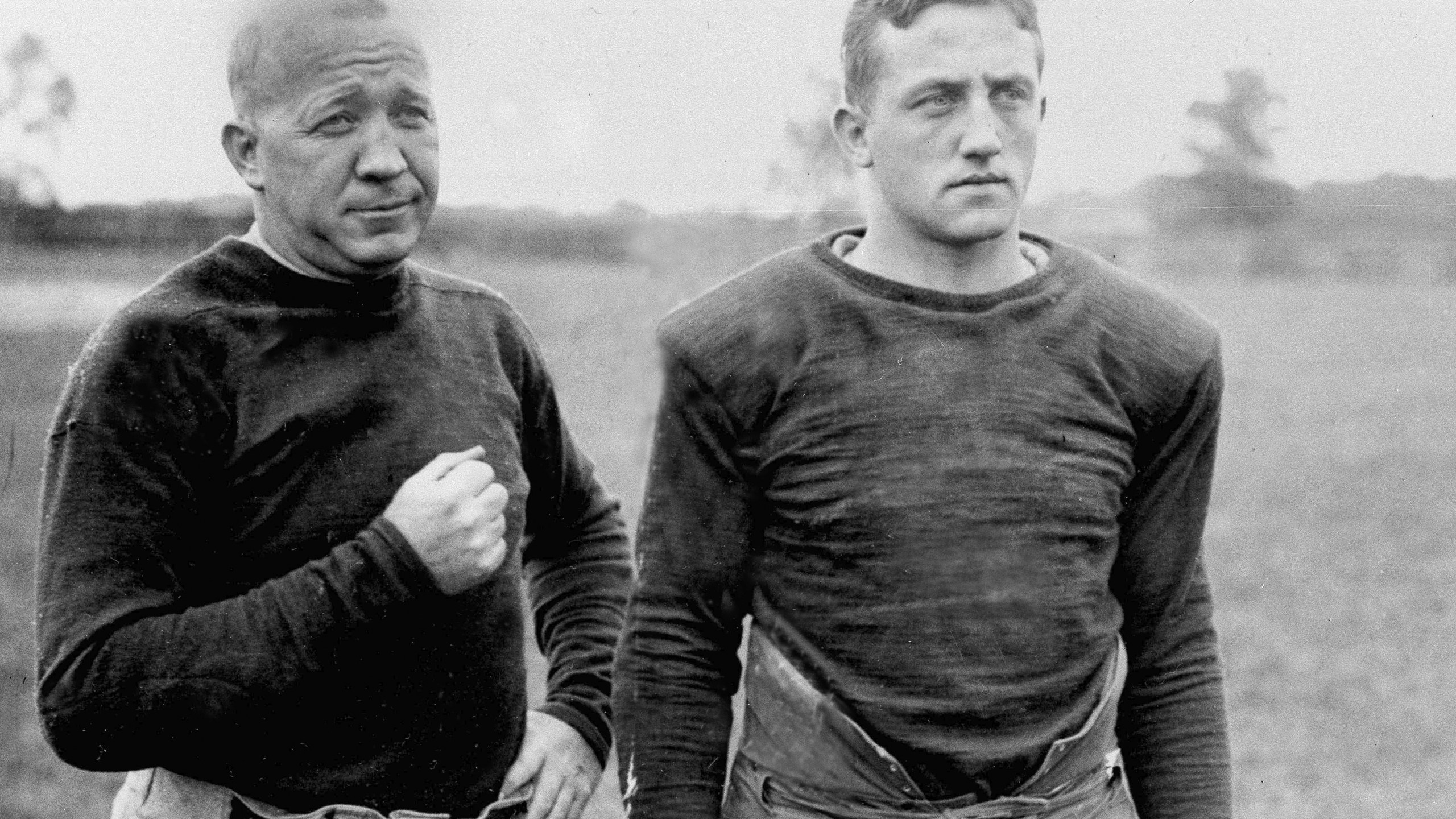 FILE - Notre Dame football coach Knute Rockne, left, and team captain Clem Crowe watch the team practice in 1925. (AP Photo/File)