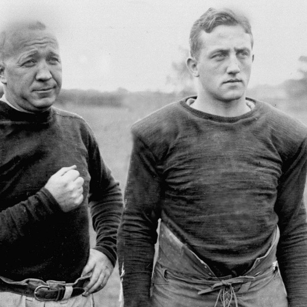 FILE - Notre Dame football coach Knute Rockne, left, and team captain Clem Crowe watch the team practice in 1925. (AP Photo/File)