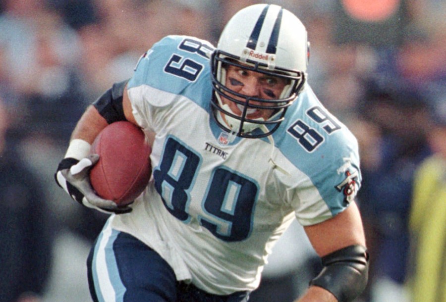 FILE - Tennessee Titans tight end Frank Wycheck runs with the ball during a football game against the Baltimore Ravens, Dec. 5, 1999, in Baltimore. (AP Photo/Roberto Borea, File)