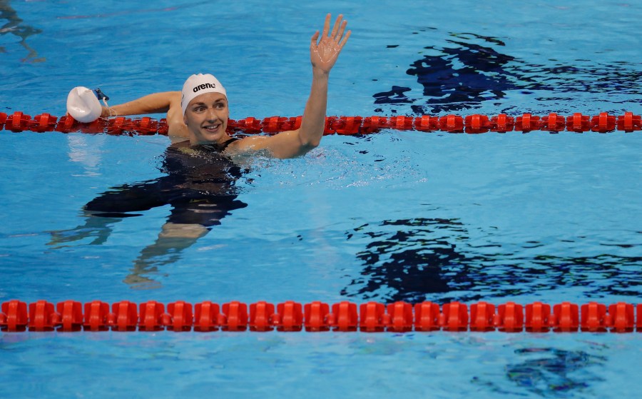 FILE - Hungary's Katinka Hosszu waves after winning a semifinal of the women's 200-meter backstroke during the swimming competitions at the 2016 Summer Olympics, Thursday, Aug. 11, 2016, in Rio de Janeiro, Brazil. (AP Photo/Natacha Pisarenko, File)