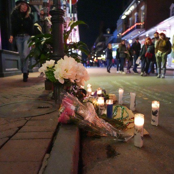 A memorial on Bourbon Street sits at the site of a deadly truck attack on New Year's Day in New Orleans, Friday, Jan. 3, 2025. (AP Photo/Gerald Herbert)