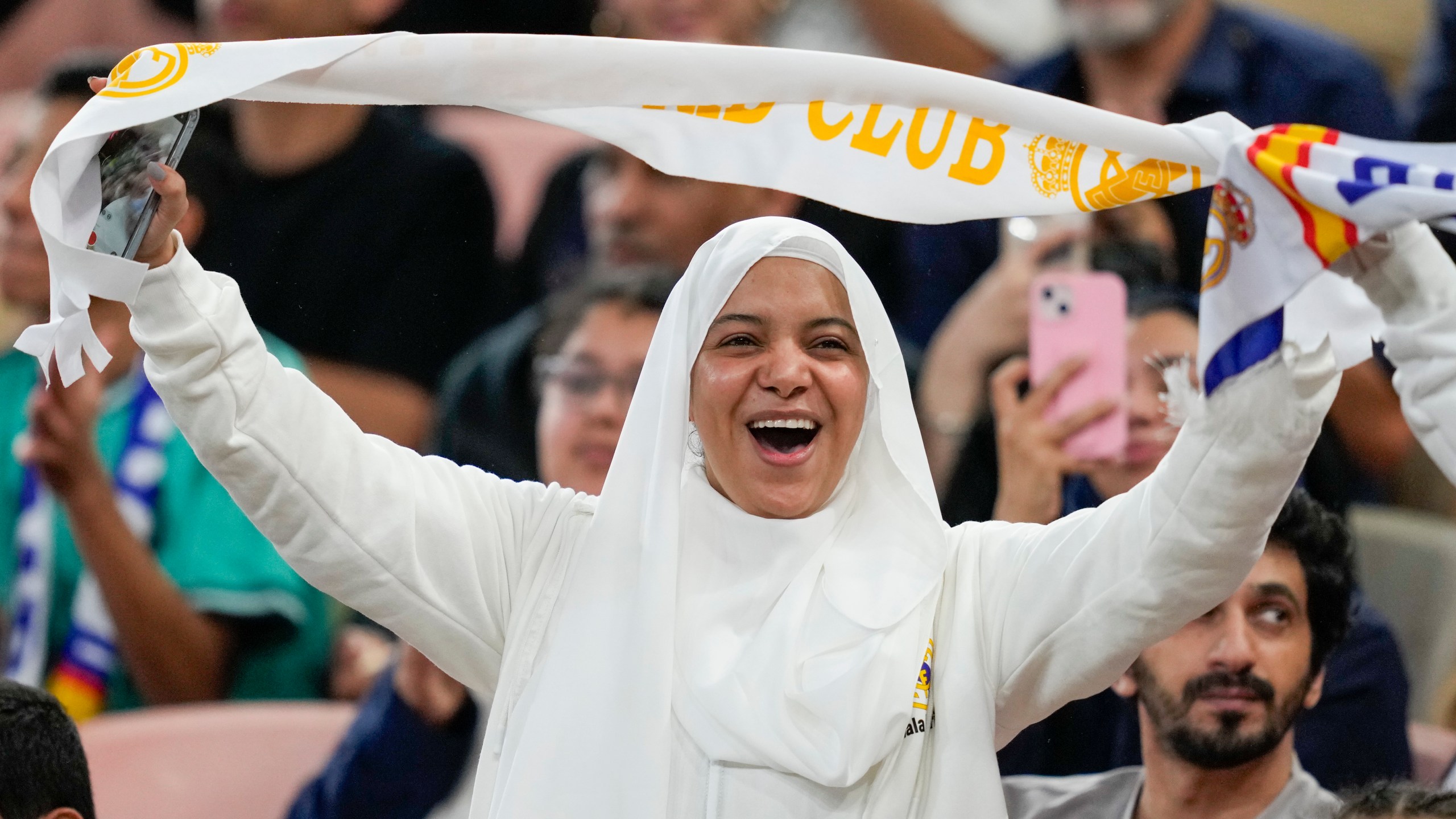 A supporter cheers before the Spanish Super Cup semifinal soccer match between Real Madrid and Mallorca at the King Abdullah Stadium in Jeddah, Saudi Arabia, Thursday, Jan. 9, 2025. (AP Photo/Altaf Qadri)