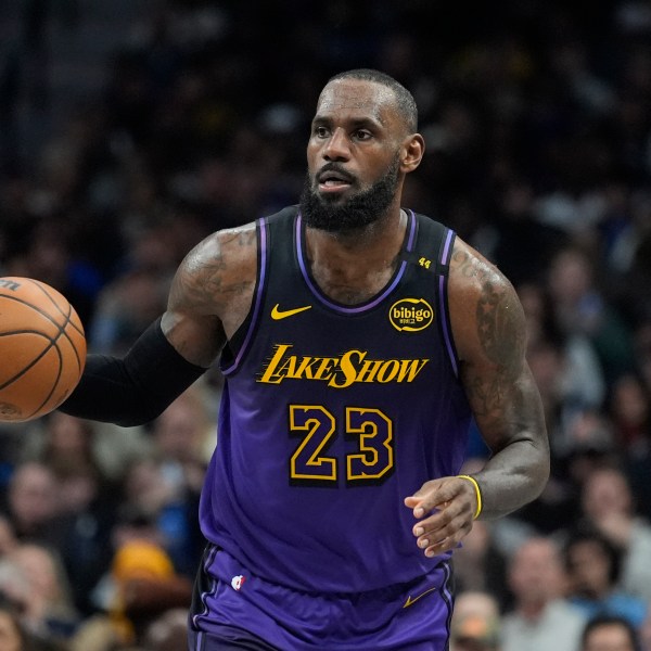 Los Angeles Lakers forward LeBron James dribbles during the second half of an NBA basketball game against the Dallas Mavericks, Tuesday, Jan. 7, 2025, in Dallas. (AP Photo/LM Otero)