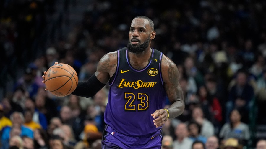 Los Angeles Lakers forward LeBron James dribbles during the second half of an NBA basketball game against the Dallas Mavericks, Tuesday, Jan. 7, 2025, in Dallas. (AP Photo/LM Otero)