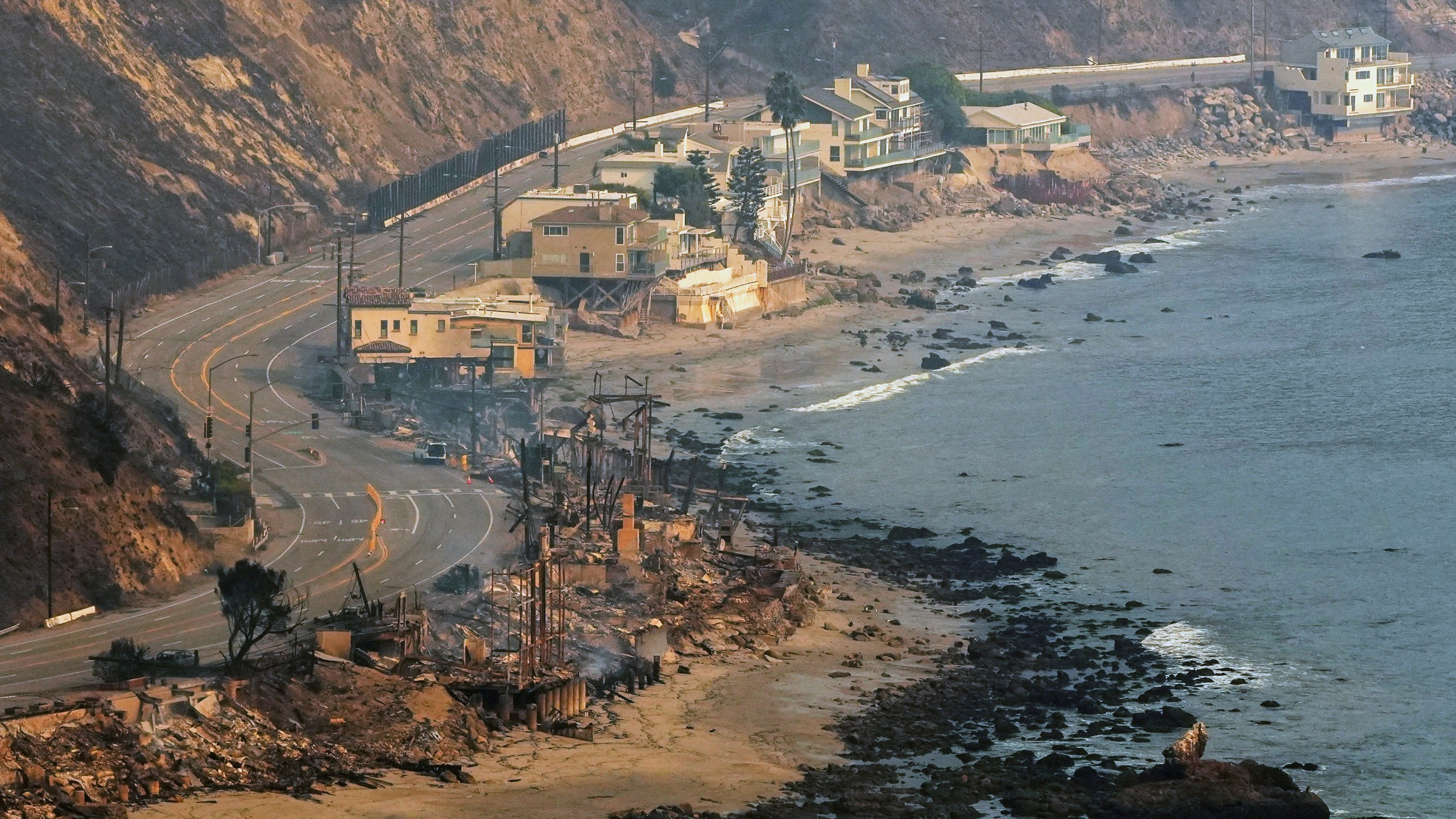 Beach front properties are left destroyed by the Palisades Fire, in this aerial view, Thursday, Jan. 9, 2025 in Malibu, Calif. (AP Photo/Mark J. Terrill)