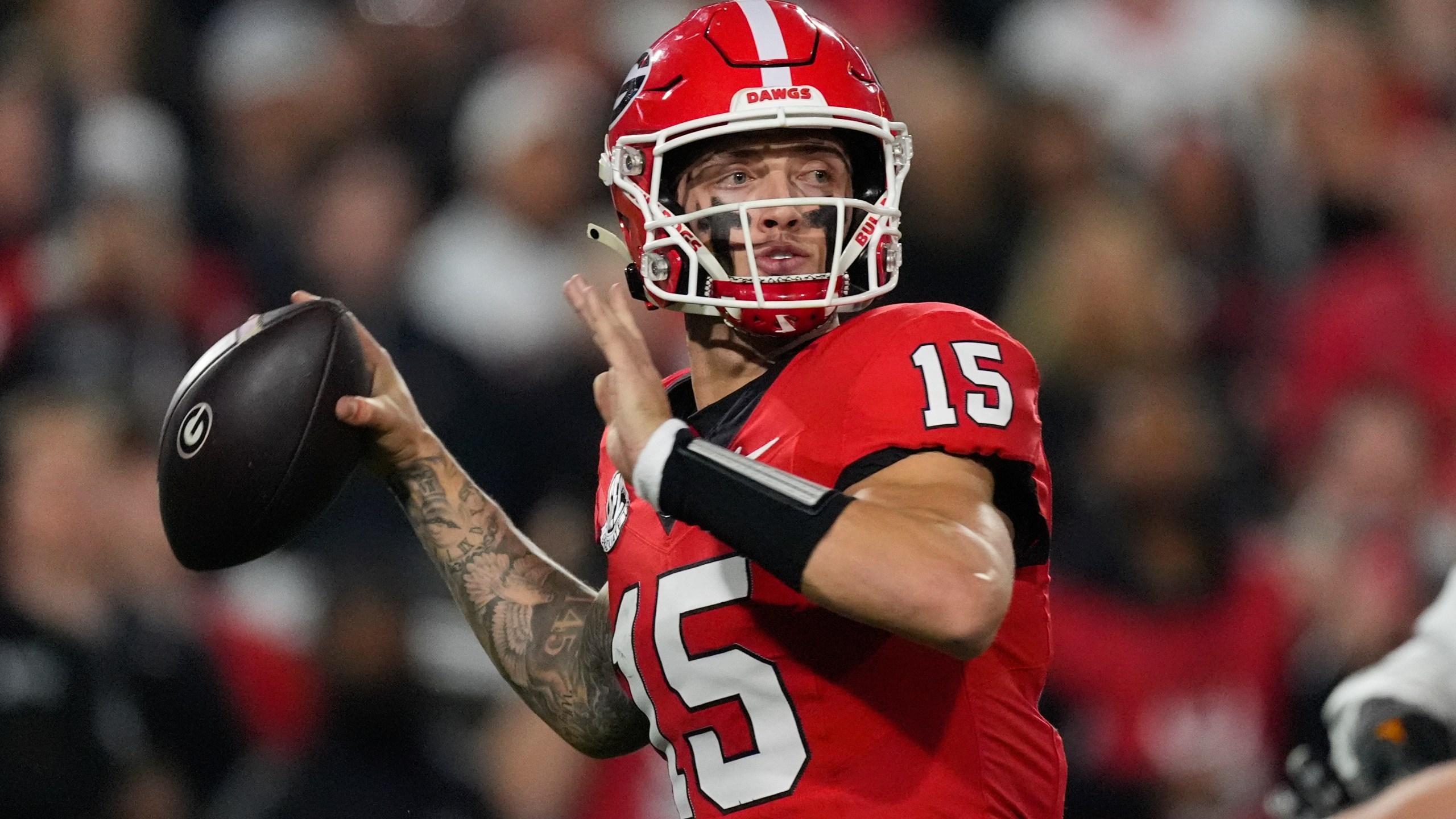 FILE - Georgia quarterback Carson Beck looks for an open receiver during the first half of an NCAA college football game against Tennessee, Nov. 16, 2024, in Athens, Ga. (AP Photo/John Bazemore, File)