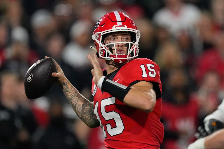 FILE - Georgia quarterback Carson Beck looks for an open receiver during the first half of an NCAA college football game against Tennessee, Nov. 16, 2024, in Athens, Ga. (AP Photo/John Bazemore, File)