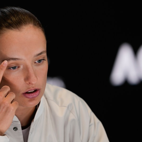 Poland's Iga Swiatek reacts during a press conference ahead of the Australian Open tennis championship in Melbourne, Australia, Friday, Jan. 10, 2025. (AP Photo/Ng Han Guan)