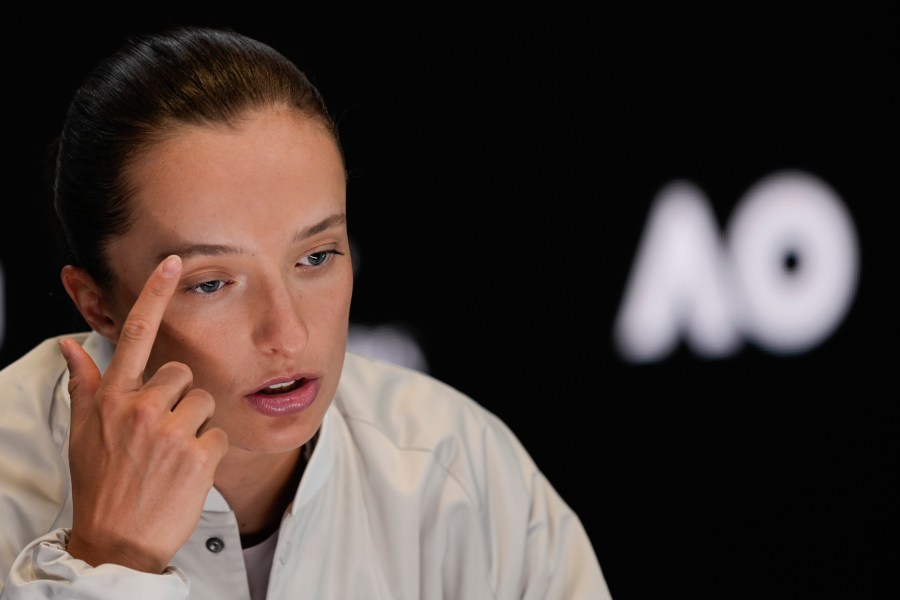 Poland's Iga Swiatek reacts during a press conference ahead of the Australian Open tennis championship in Melbourne, Australia, Friday, Jan. 10, 2025. (AP Photo/Ng Han Guan)