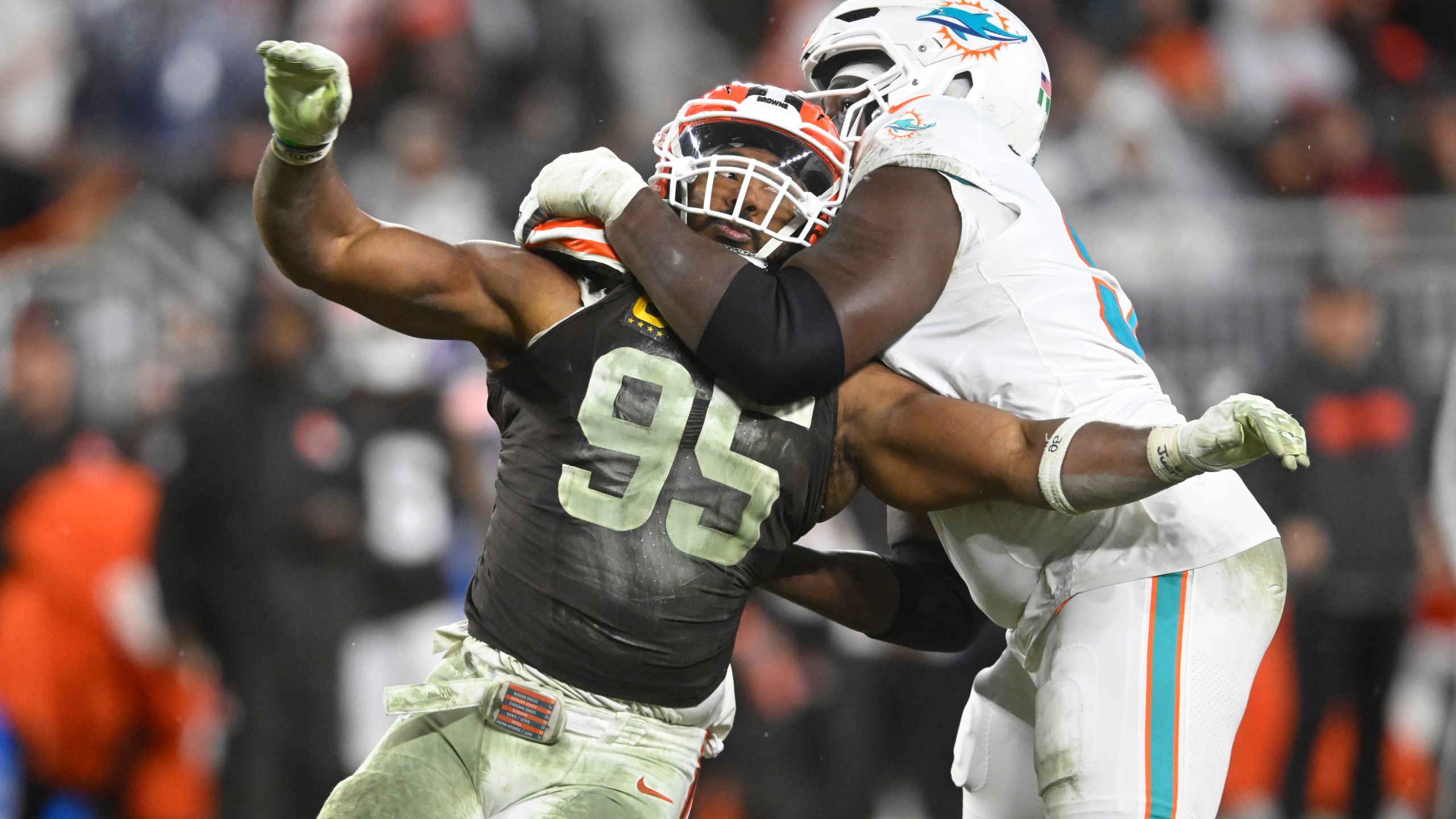 Cleveland Browns defensive end Myles Garrett (95) is pressured by Miami Dolphins offensive tackle Patrick Paul, right, during the second half of an NFL football game Sunday, Dec. 29, 2024, in Cleveland. (AP Photo/David Richard)