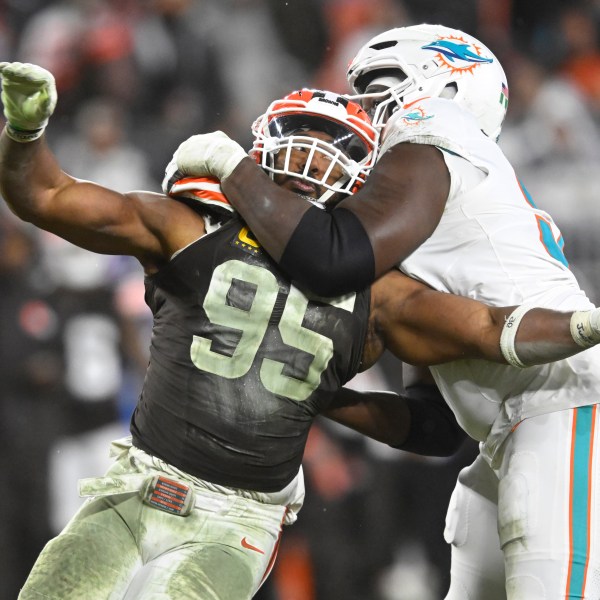 Cleveland Browns defensive end Myles Garrett (95) is pressured by Miami Dolphins offensive tackle Patrick Paul, right, during the second half of an NFL football game Sunday, Dec. 29, 2024, in Cleveland. (AP Photo/David Richard)