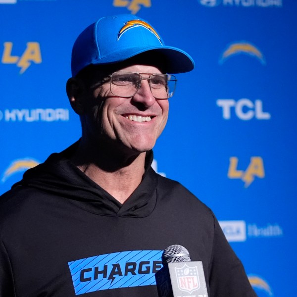 Los Angeles Chargers head coach Jim Harbaugh listens to a reporter's question during a news conference following an NFL football game, Saturday, Dec. 28, 2024, in Foxborough, Mass. (AP Photo/Robert F. Bukaty)