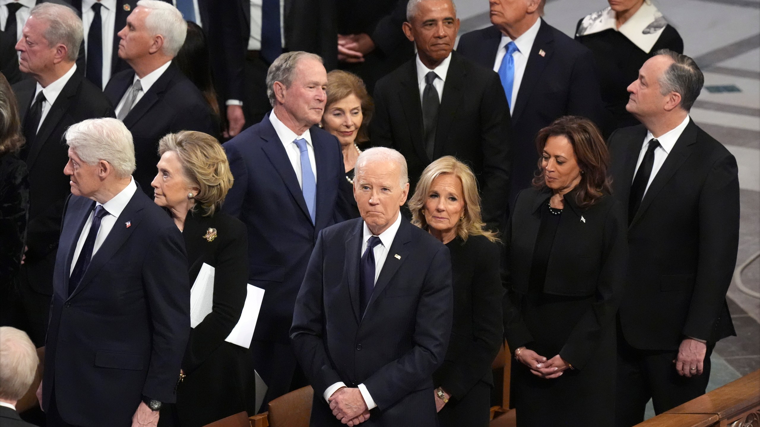 President Joe Biden and first lady Jill Biden watch as the state funeral for former President Jimmy Carter begins at Washington National Cathedral in Washington, Thursday, Jan. 9, 2025. (AP Photo/Jacquelyn Martin)