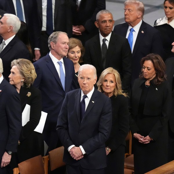 President Joe Biden and first lady Jill Biden watch as the state funeral for former President Jimmy Carter begins at Washington National Cathedral in Washington, Thursday, Jan. 9, 2025. (AP Photo/Jacquelyn Martin)