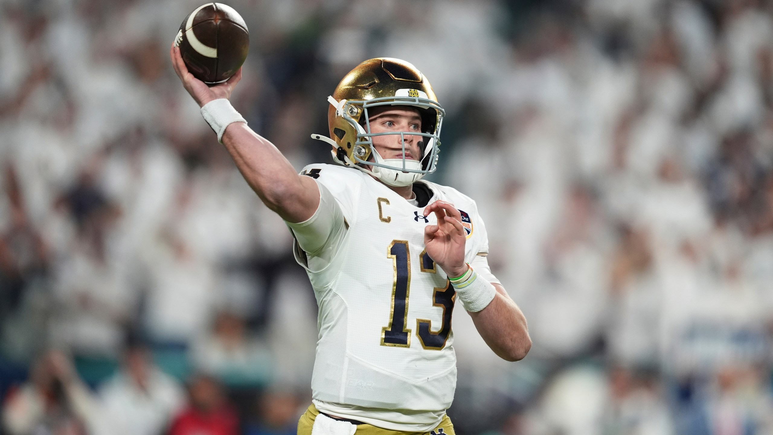 Notre Dame quarterback Riley Leonard (13) aims a pass during first half of the Orange Bowl NCAA College Football Playoff semifinal game against Penn State, Thursday, Jan. 9, 2025, in Miami Gardens, Fla. (AP Photo/Rebecca Blackwell)