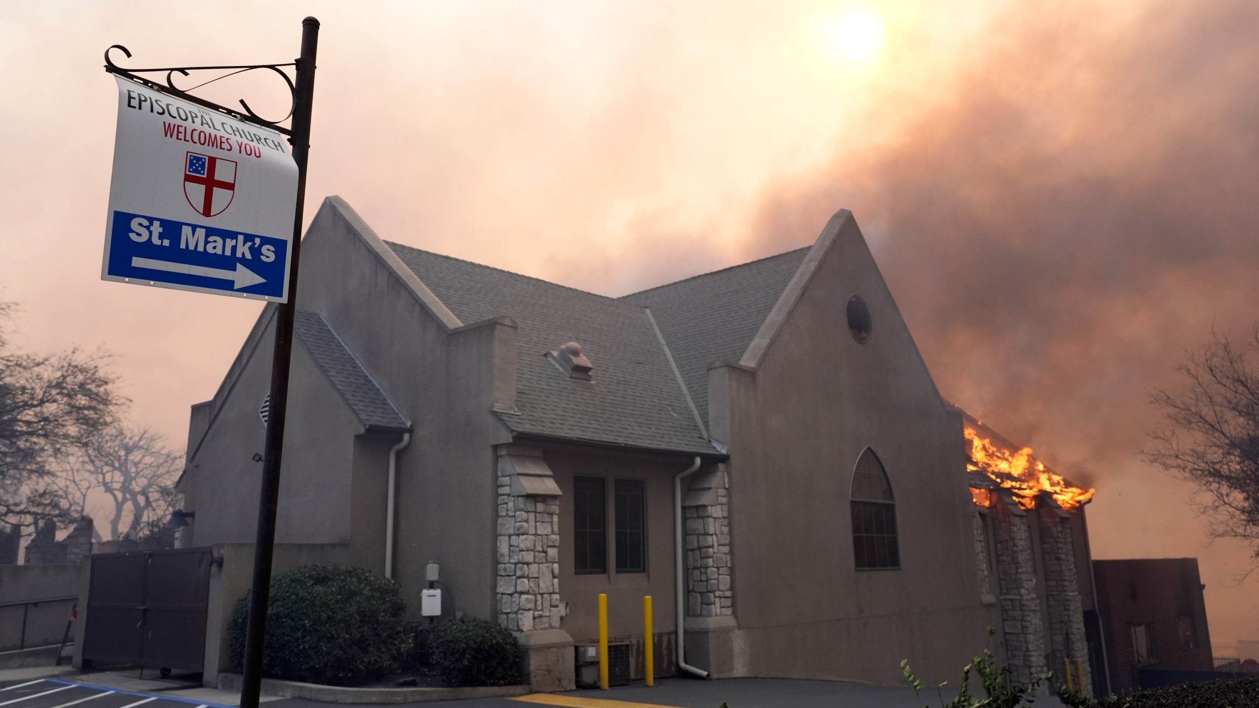 Flames rise out of St. Mark's Episcopal Church, Wednesday, Jan. 8, 2025, in the downtown Altadena section of Pasadena, Calif. (AP Photo/Chris Pizzello)