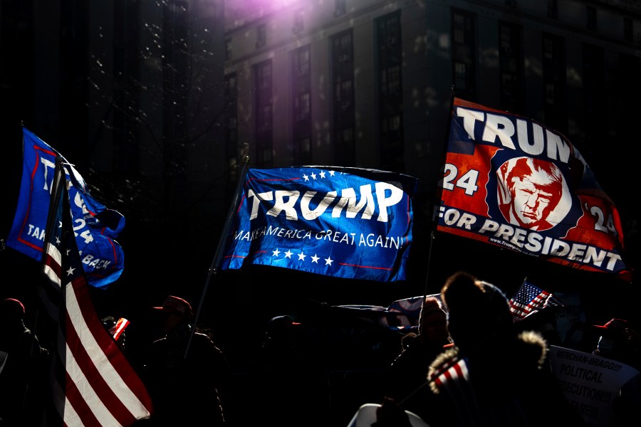 Demonstrators wave Trump flags outside Manhattan criminal court following the sentencing in President-elect Donald Trump's hush money case in New York, Friday, Jan. 10, 2025. (AP Photo/Julia Demaree Nikhinson)