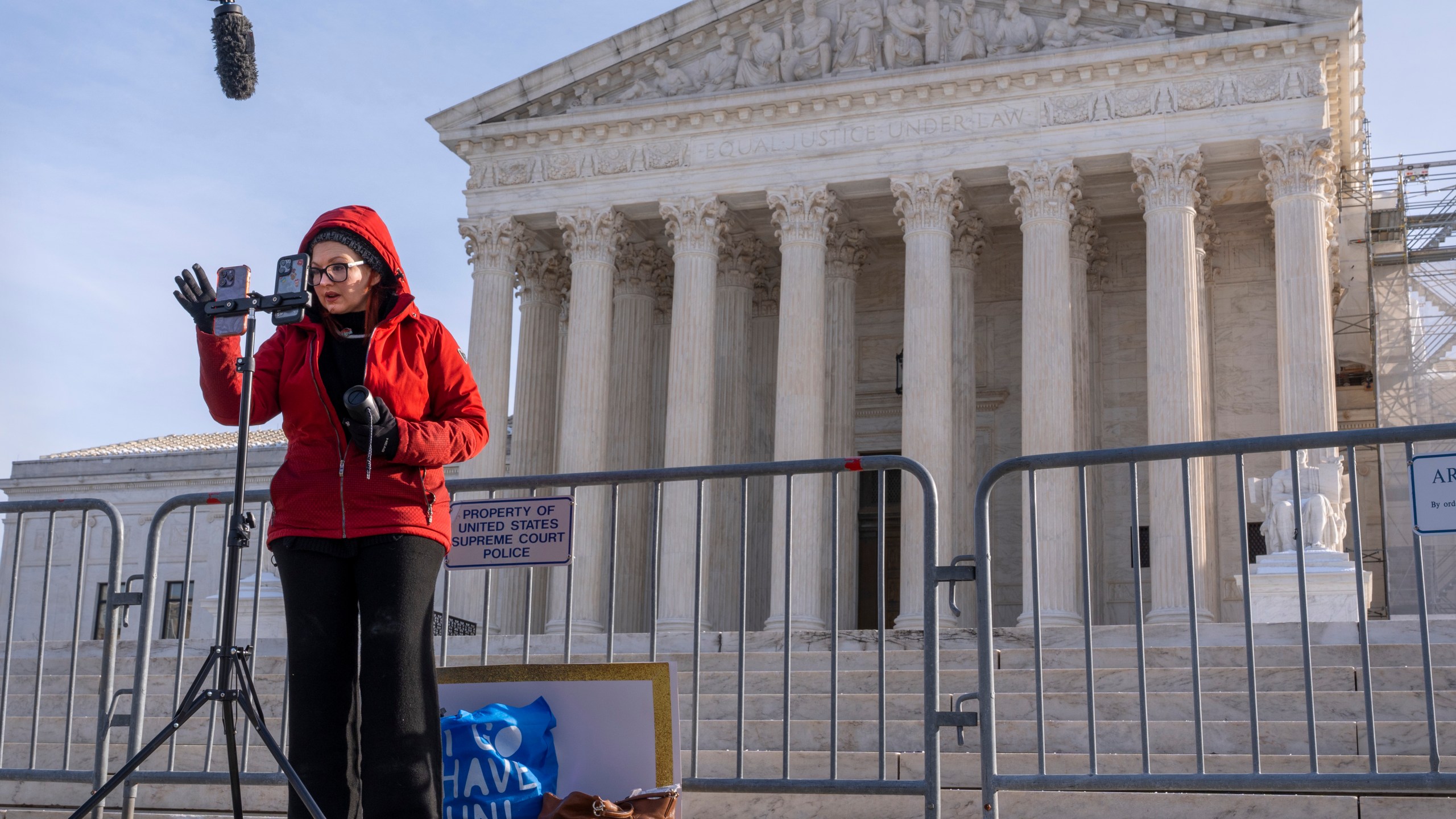 Tiffany Cianci, who says she is a "long form educational content creator," livestreams to TikTok, outside the Supreme Court, Friday, Jan. 10, 2025, in Washington. (AP Photo/Jacquelyn Martin)