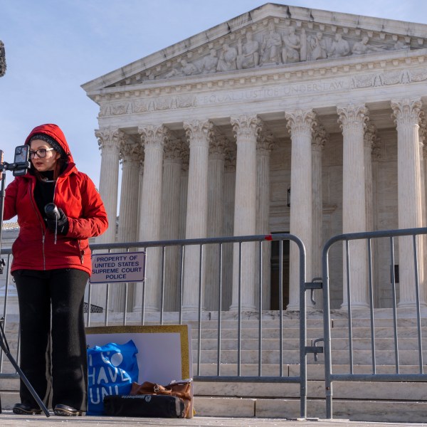 Tiffany Cianci, who says she is a "long form educational content creator," livestreams to TikTok, outside the Supreme Court, Friday, Jan. 10, 2025, in Washington. (AP Photo/Jacquelyn Martin)