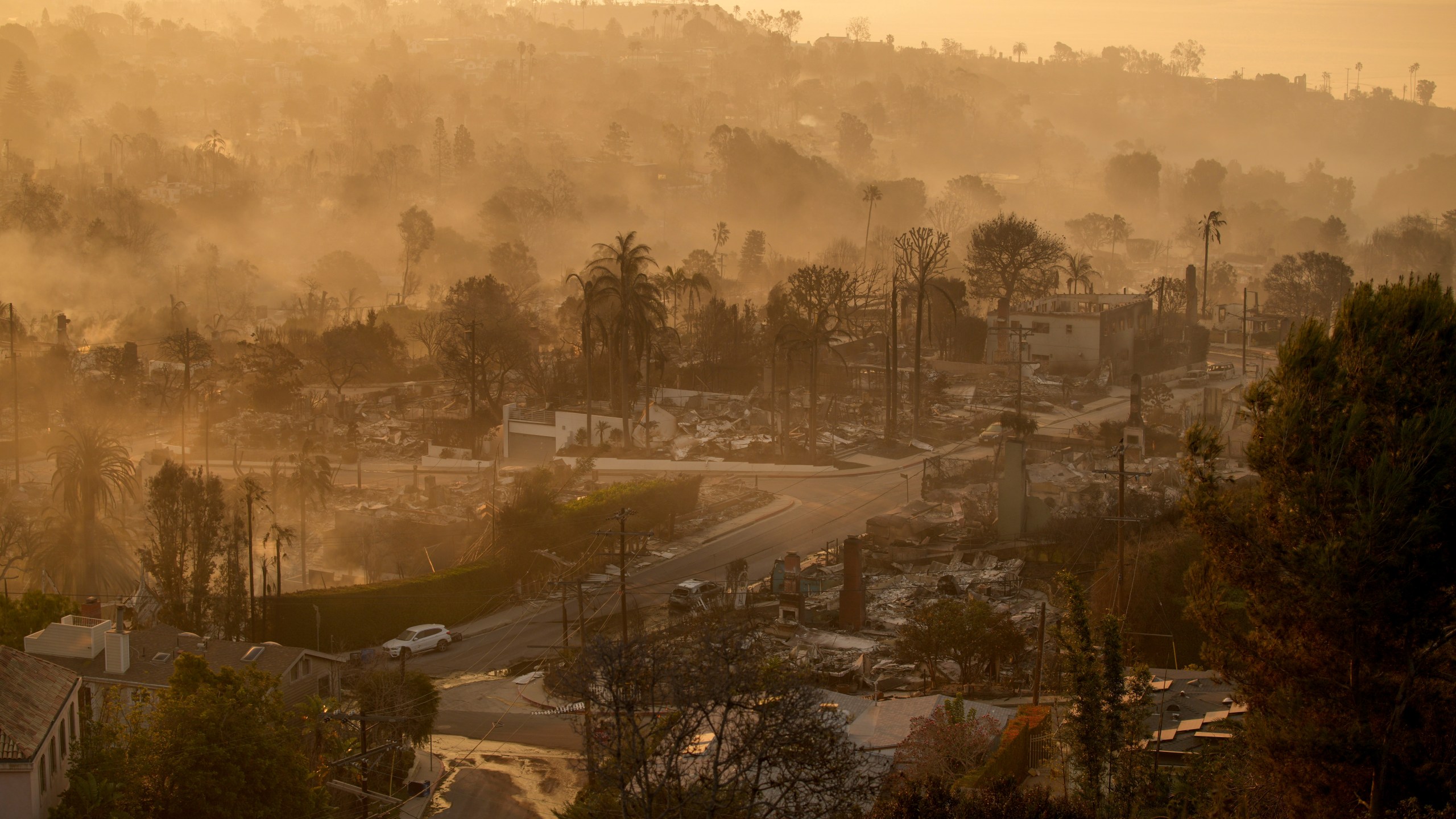 The devastation of the Palisades Fire is seen in the early morning in the Pacific Palisades neighborhood of Los Angeles, Friday, Jan. 10, 2025. (AP Photo/John Locher)