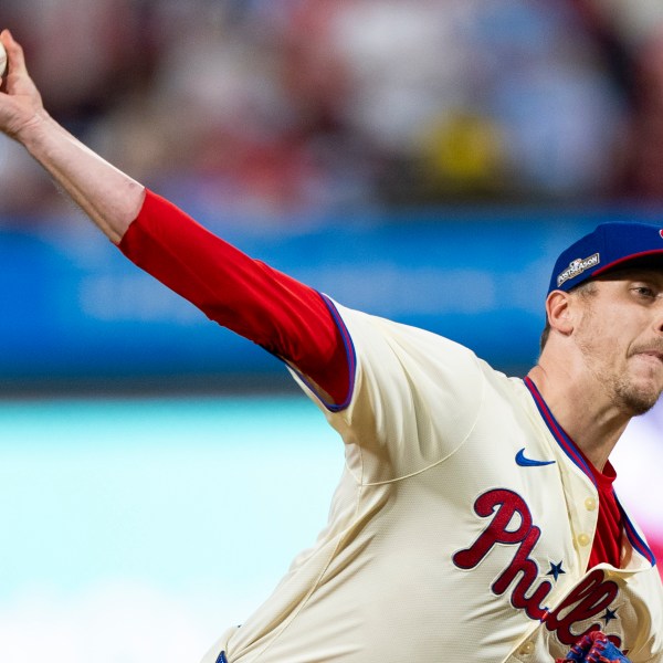 FILE - Philadelphia Phillies relief pitcher Jeff Hoffman delivers during Game 2 of a baseball NL Division Series against the New York Mets, Oct. 6, 2024, in Philadelphia. (AP Photo/Chris Szagola, File)