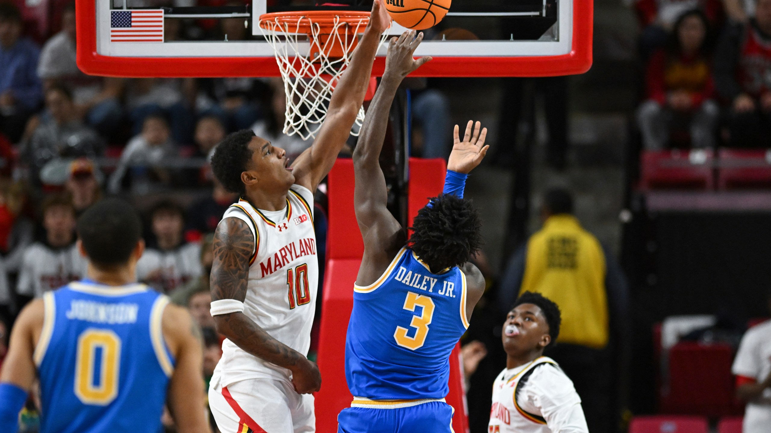 Maryland forward Julian Reese (10) blocks UCLA guard Eric Dailey Jr. (3) shot during the second half of an NCAA college basketball game, Friday, Jan. 10, 2025, in College Park, Md. (AP Photo/Terrance Williams)