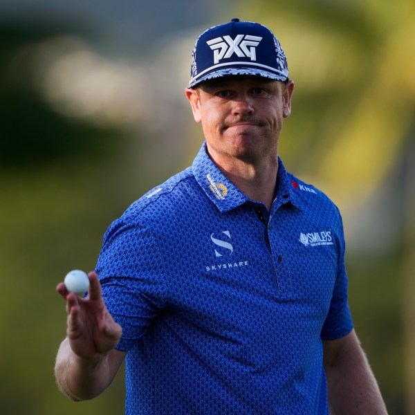 Patrick Fishburn reacts after making his shot on the ninth green during the second round of the Sony Open golf event, Friday, Jan. 10, 2025, at Waialae Country Club in Honolulu. (AP Photo/Matt York)