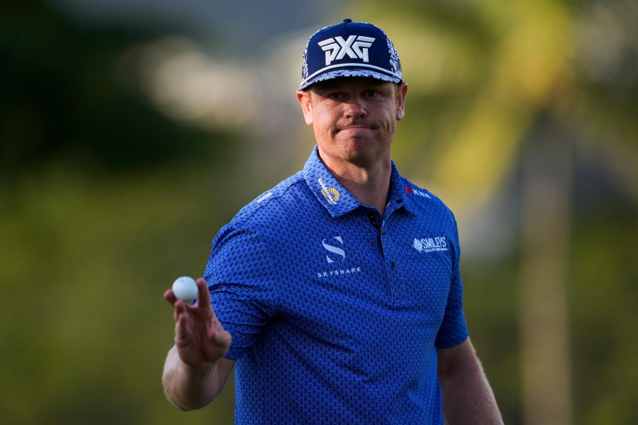 Patrick Fishburn reacts after making his shot on the ninth green during the second round of the Sony Open golf event, Friday, Jan. 10, 2025, at Waialae Country Club in Honolulu. (AP Photo/Matt York)