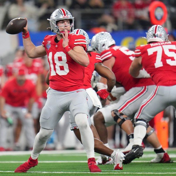 Ohio State quarterback Will Howard (18) passes against Texas during the first half of the Cotton Bowl College Football Playoff semifinal game, Friday, Jan. 10, 2025, in Arlington, Texas. (AP Photo/Julio Cortez)