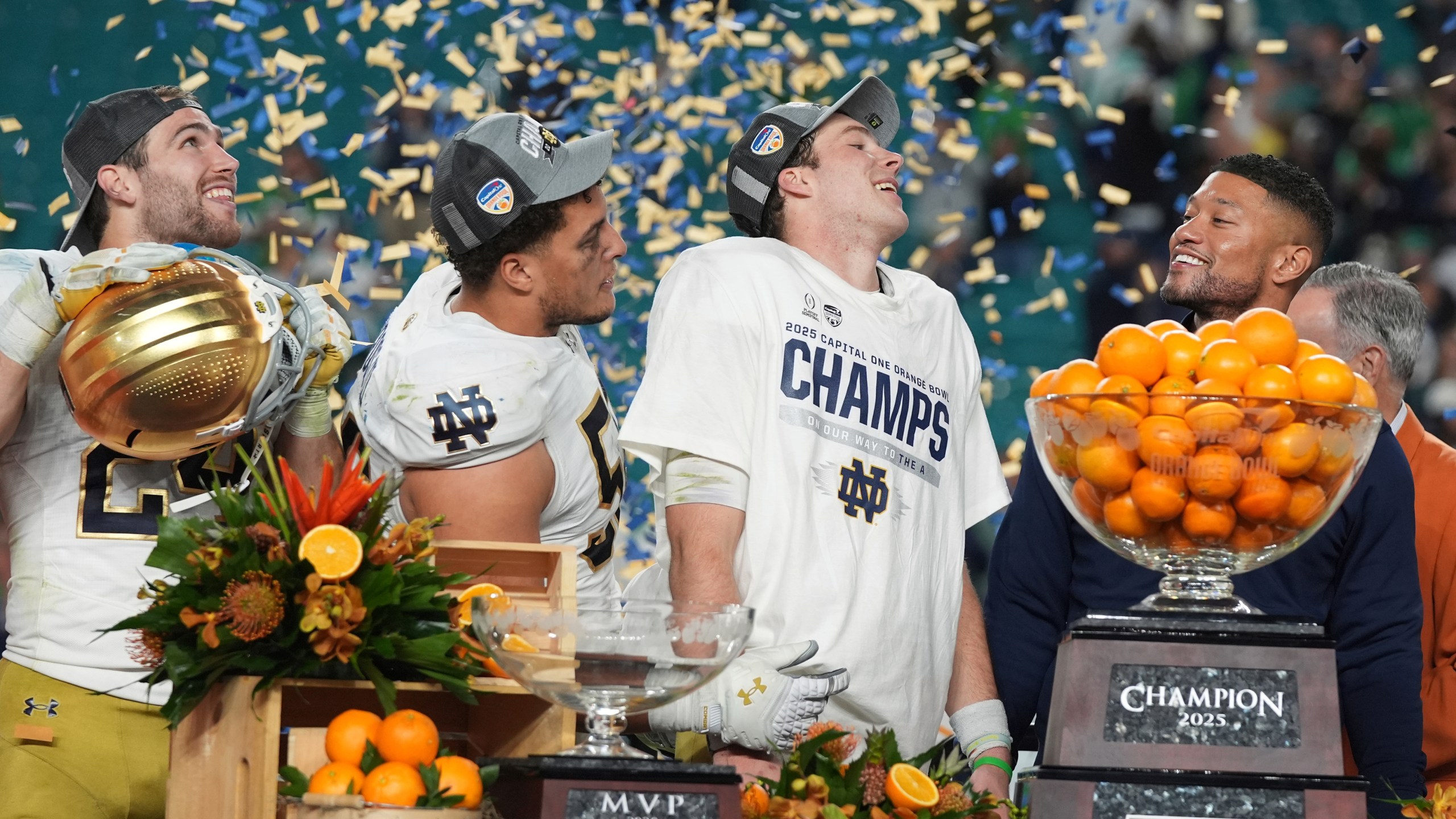 Notre Dame head coach Marcus Freeman and members of the team celebrate after winning the Orange Bowl College Football Playoff semifinal game against Penn State, Thursday, Jan. 9, 2025, in Miami Gardens, Fla. (AP Photo/Lynne Sladky)