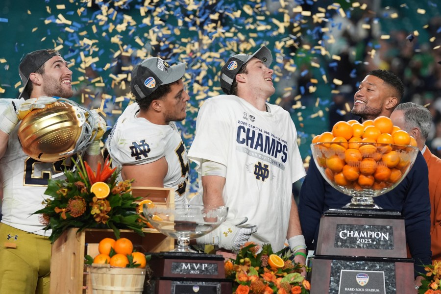 Notre Dame head coach Marcus Freeman and members of the team celebrate after winning the Orange Bowl College Football Playoff semifinal game against Penn State, Thursday, Jan. 9, 2025, in Miami Gardens, Fla. (AP Photo/Lynne Sladky)