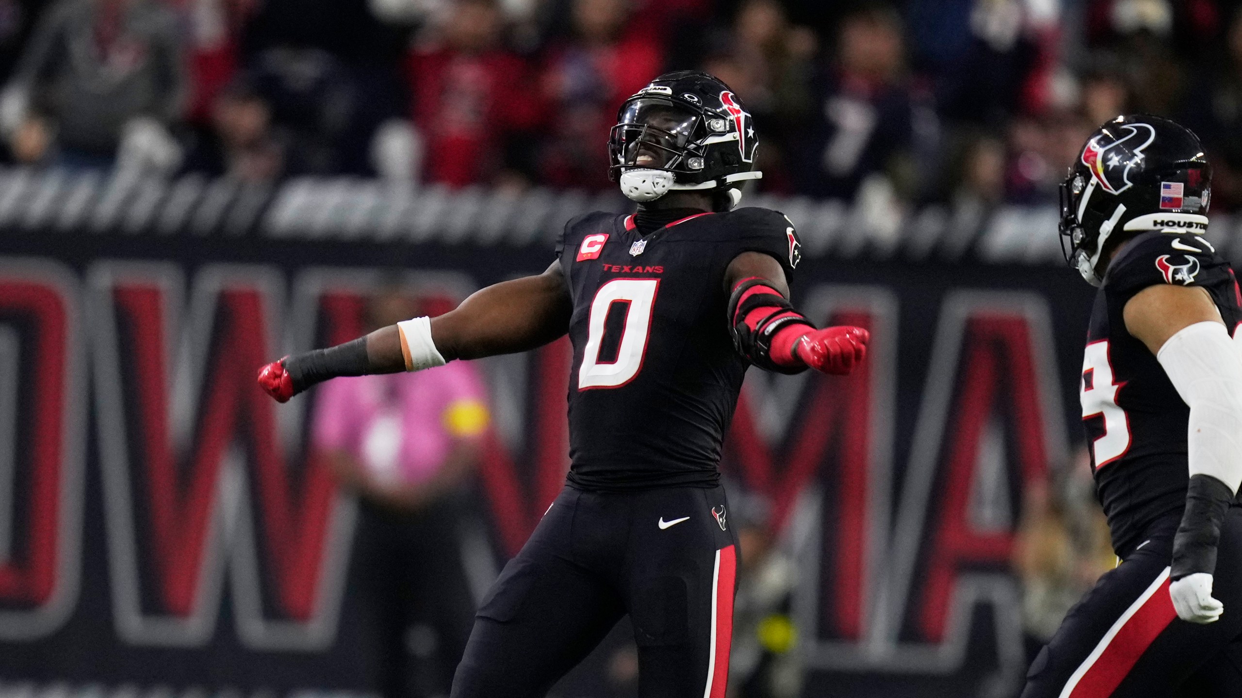 Houston Texans' Azeez Al-Shaair (0) celebrates after making a tackle against the Los Angeles Chargers during the second half of an NFL wild-card playoff football game Saturday, Jan. 11, 2025, in Houston. (AP Photo/Eric Christian Smith)