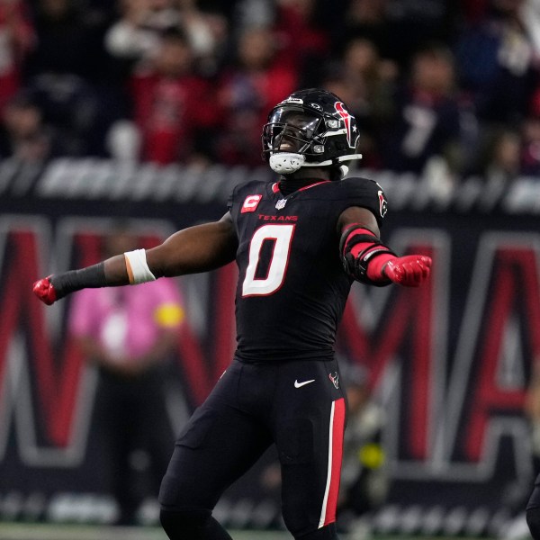 Houston Texans' Azeez Al-Shaair (0) celebrates after making a tackle against the Los Angeles Chargers during the second half of an NFL wild-card playoff football game Saturday, Jan. 11, 2025, in Houston. (AP Photo/Eric Christian Smith)