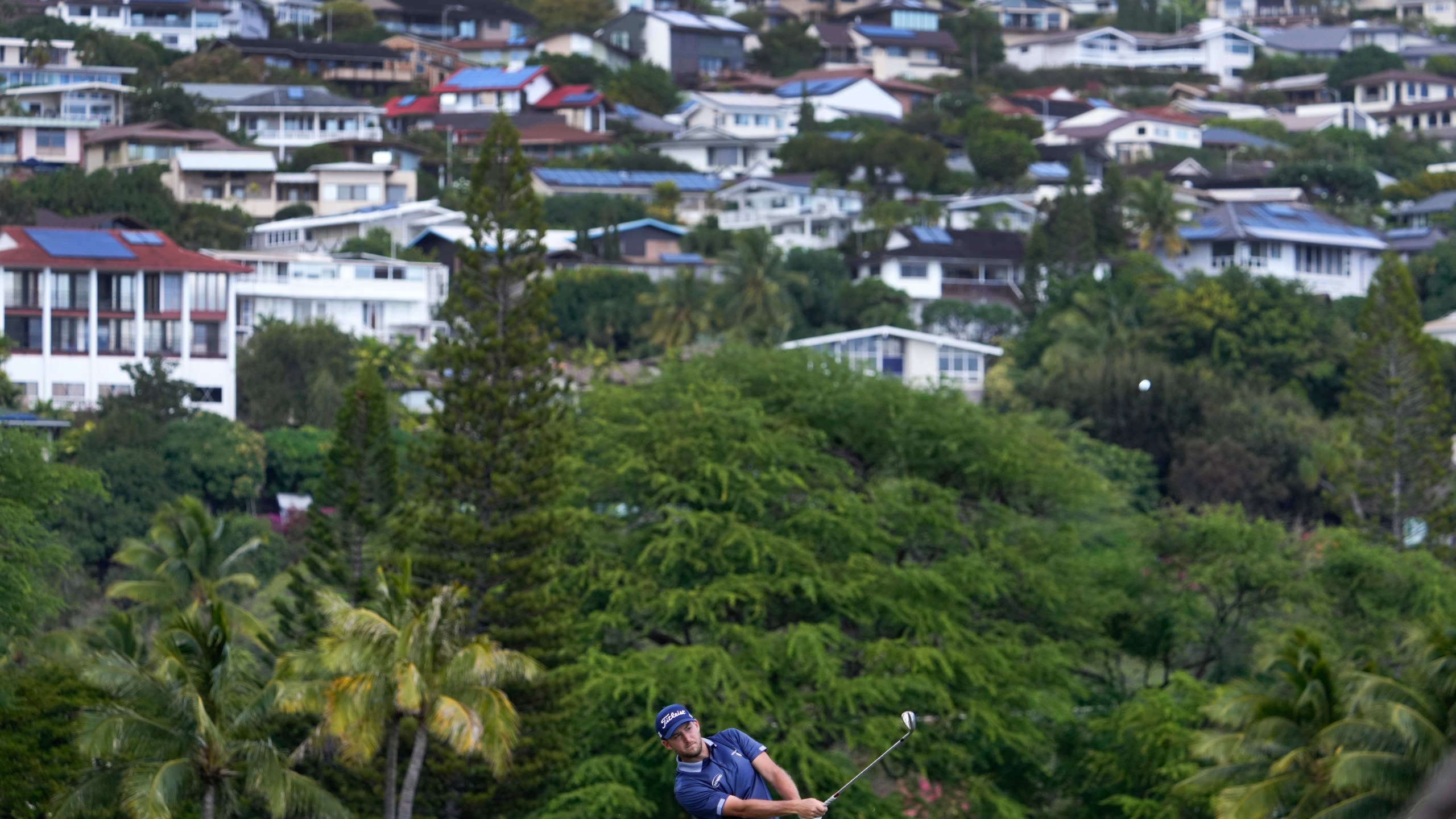 Lee Hodges hits on the 16th fairway during the third round of the Sony Open golf tournament, Saturday, Jan. 11, 2025, at Waialae Country Club in Honolulu. (AP Photo/Matt York)