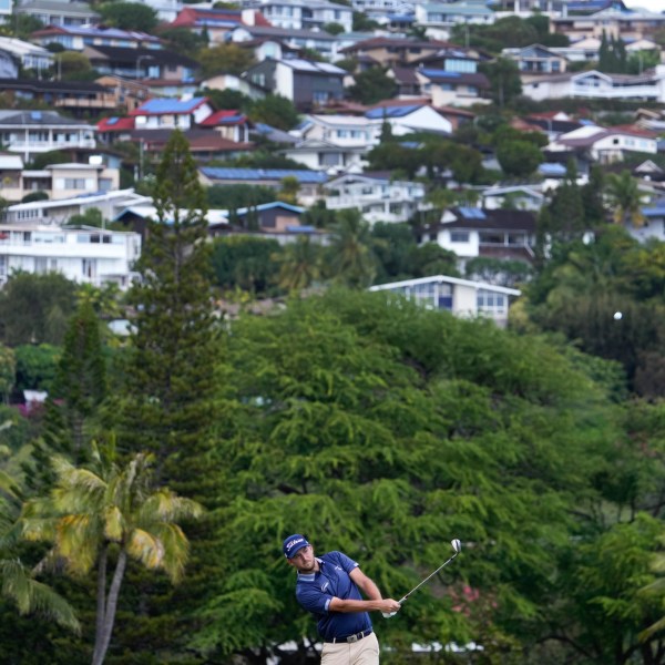 Lee Hodges hits on the 16th fairway during the third round of the Sony Open golf tournament, Saturday, Jan. 11, 2025, at Waialae Country Club in Honolulu. (AP Photo/Matt York)