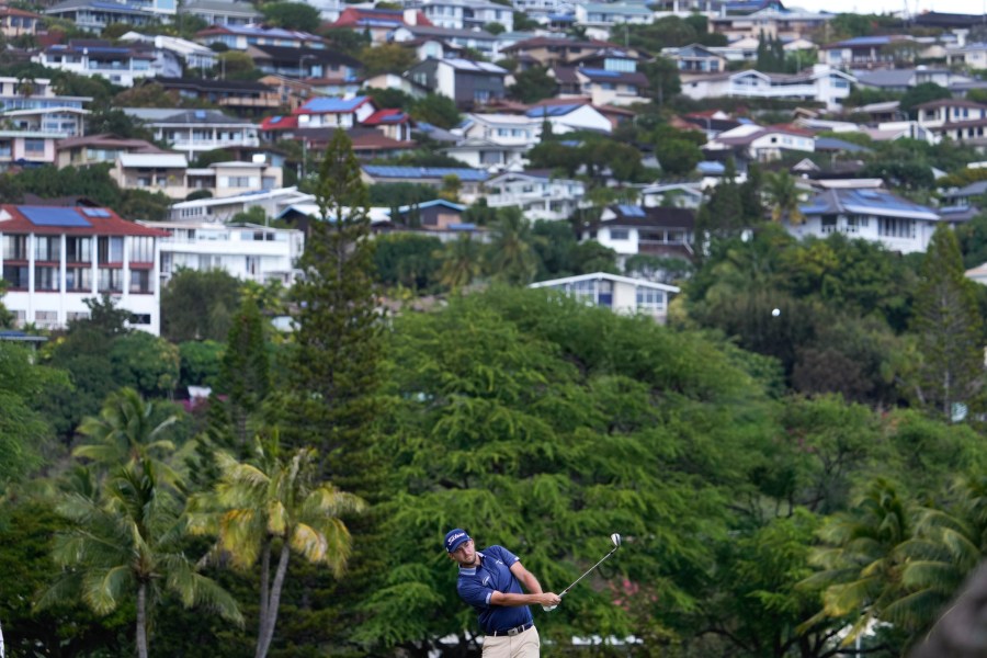 Lee Hodges hits on the 16th fairway during the third round of the Sony Open golf tournament, Saturday, Jan. 11, 2025, at Waialae Country Club in Honolulu. (AP Photo/Matt York)