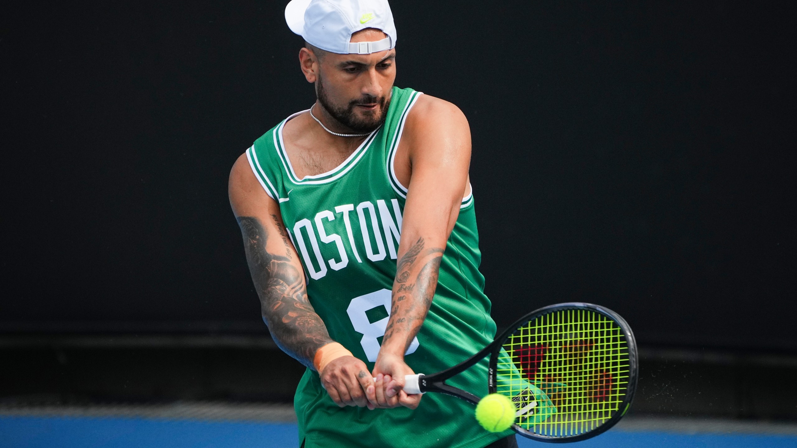 Australia's Nick Kyrgios plays a backhand return during a practice session ahead of the Australian Open tennis championship in Melbourne, Australia, Friday, Jan. 10, 2025. (AP Photo/Vincent Thian)