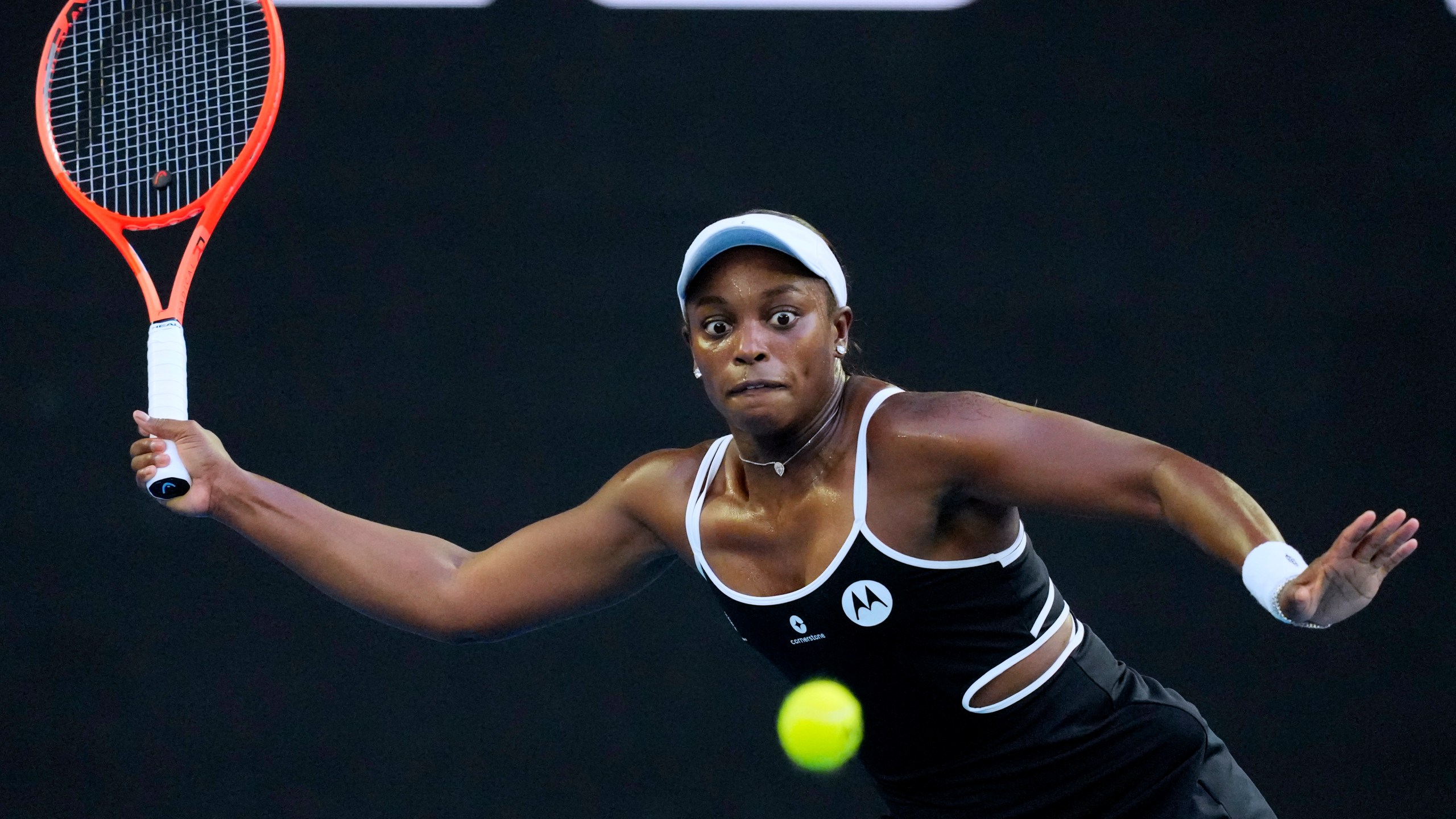 Sloane Stephens of the U.S. plays a forehand return to Aryna Sabalenka of Belarus during their first round match at the Australian Open tennis championship in Melbourne, Australia, Sunday, Jan. 12, 2025. (AP Photo/Vincent Thian)