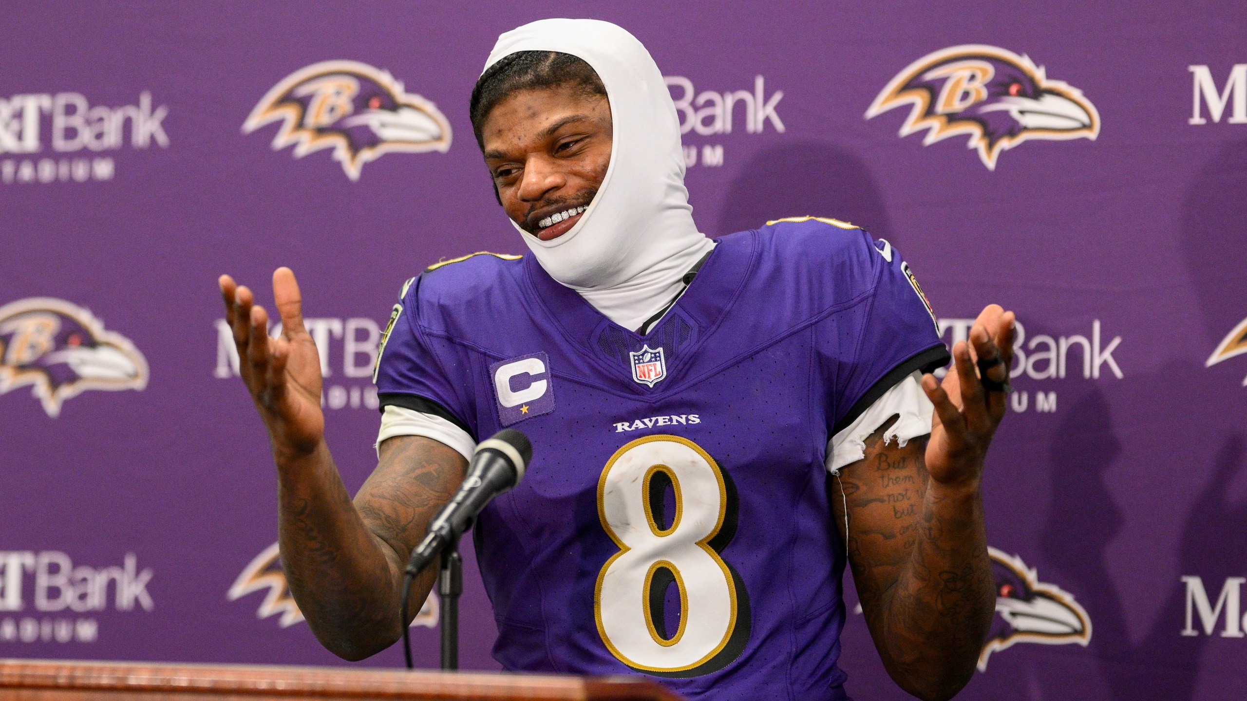 Baltimore Ravens quarterback Lamar Jackson talks to reporters following an NFL wild-card playoff football game against the Pittsburgh Steelers, Saturday, Jan. 11, 2025, in Baltimore. The Ravens won 28-14. (AP Photo/Nick Wass)