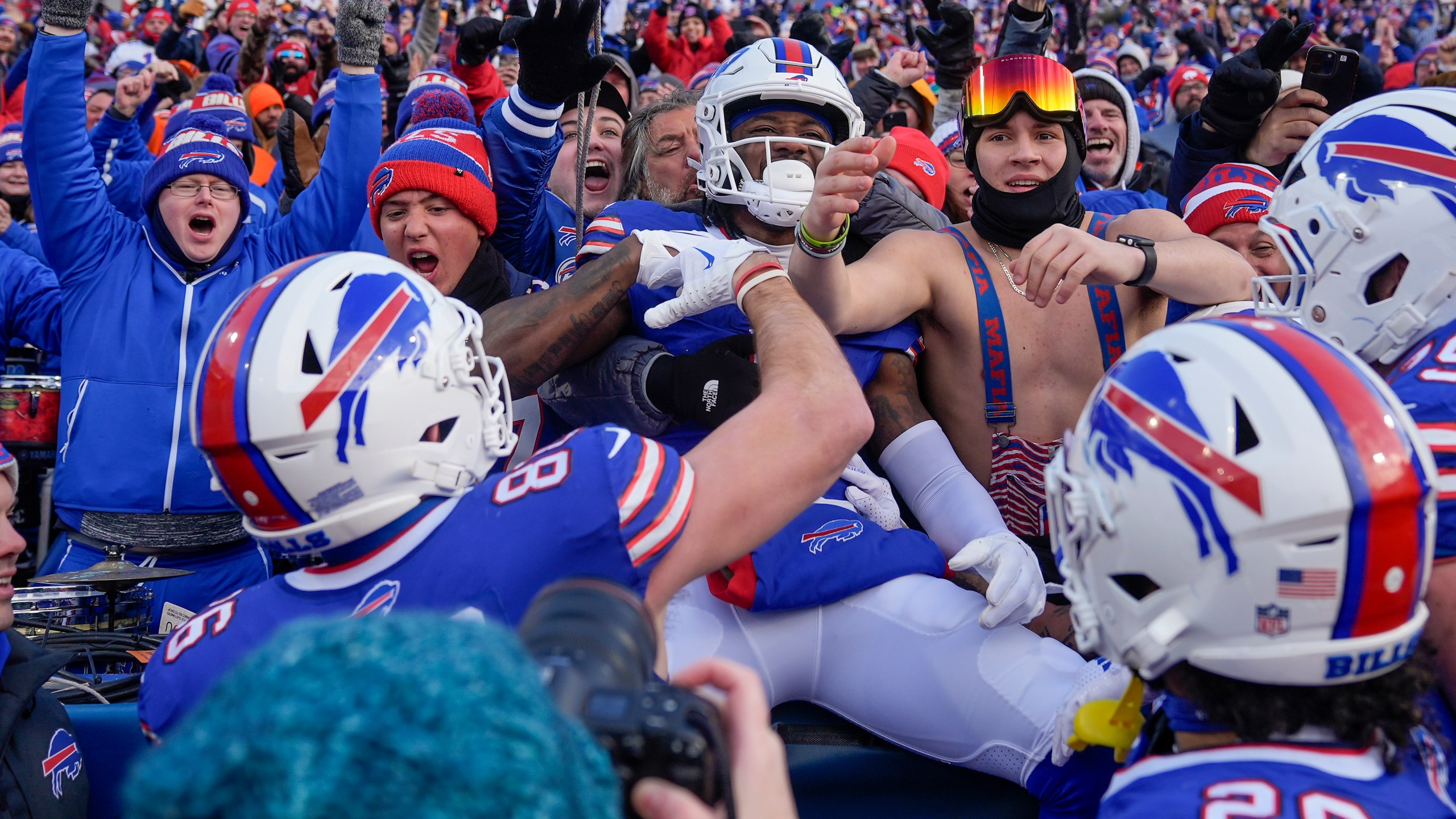 Buffalo Bills wide receiver Curtis Samuel (1) celebrates with fans after scoring a touchdown against the Denver Broncos during the fourth quarter of an NFL wild card playoff football game, Sunday, Jan. 12, 2025, in Orchard Park, N.Y. (AP Photo/Seth Wenig)