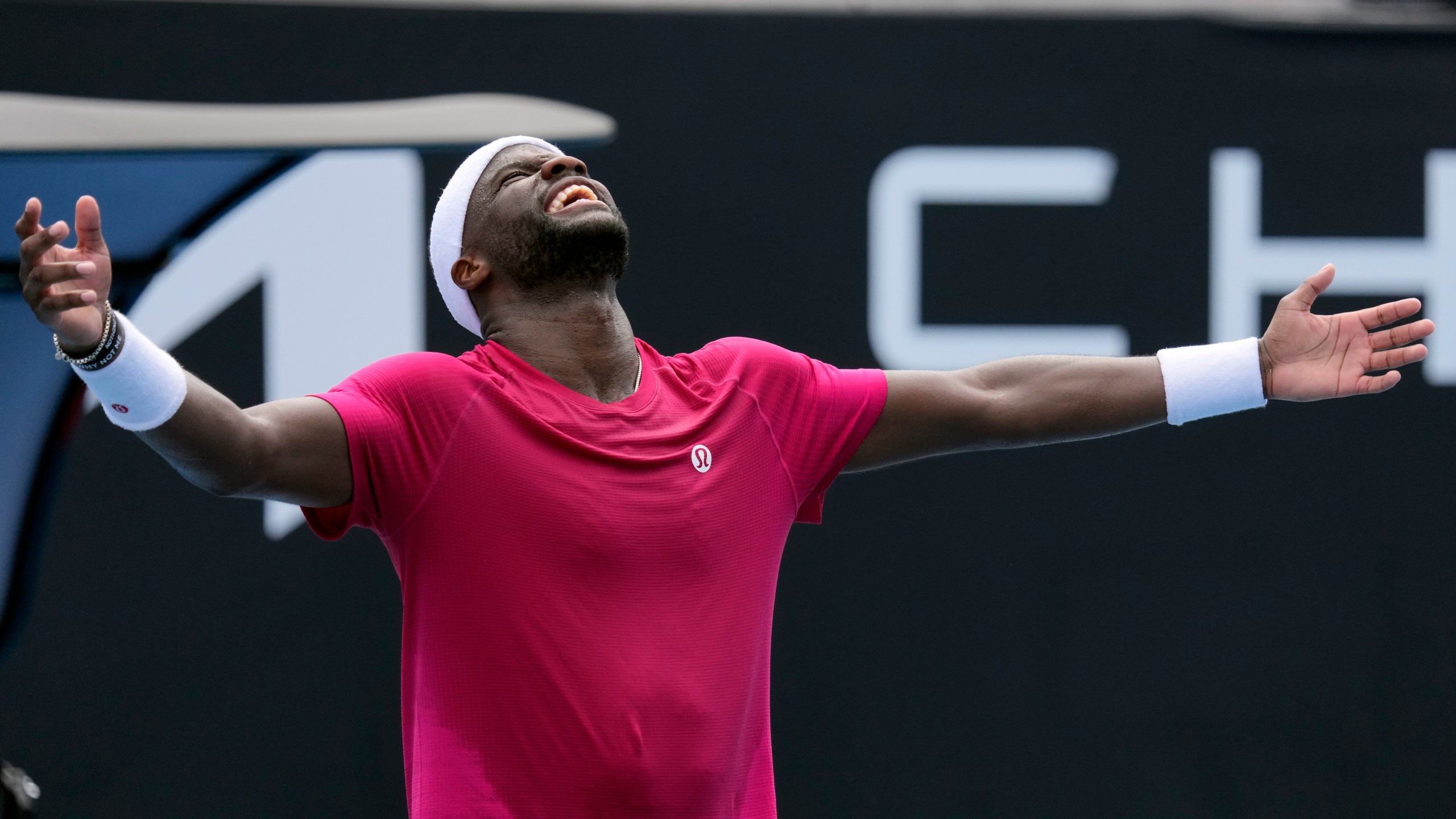 Frances Tiafoe of the U.S. celebrates after defeating Arthur Rinderknech of France in their first round match at the Australian Open tennis championship in Melbourne, Australia, Monday, Jan. 13, 2025. (AP Photo/Vincent Thian)