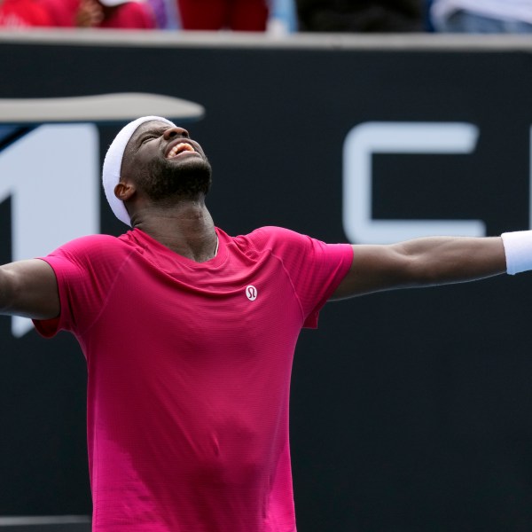 Frances Tiafoe of the U.S. celebrates after defeating Arthur Rinderknech of France in their first round match at the Australian Open tennis championship in Melbourne, Australia, Monday, Jan. 13, 2025. (AP Photo/Vincent Thian)